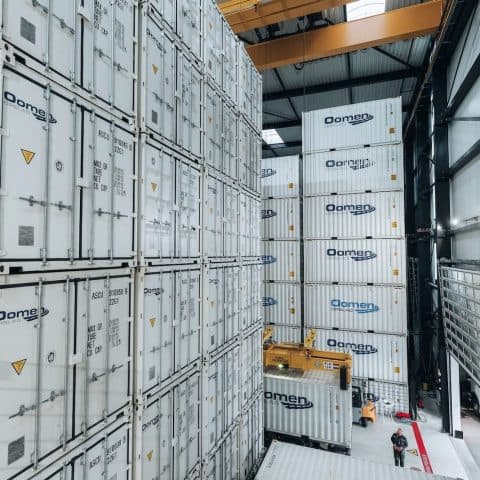 Storage containers stacked high in the Oomen storage warehouse